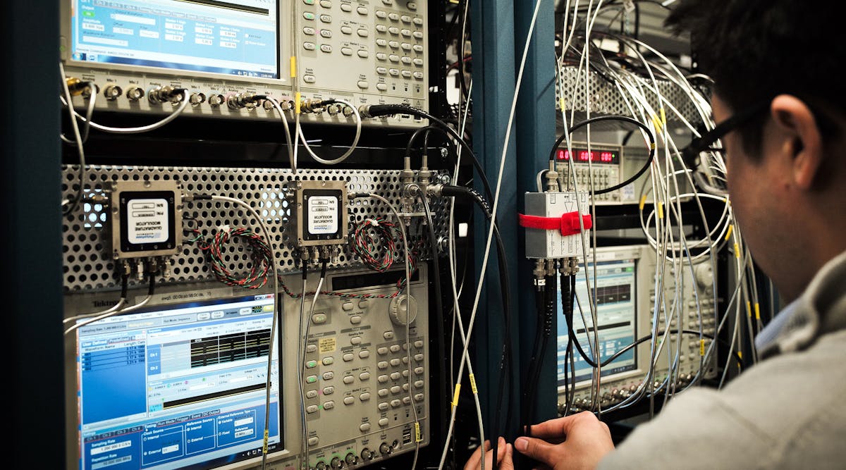 An engineer calibrates microwave waveform generators. (Image courtesy of IBM).
