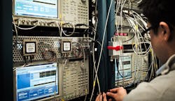 An engineer calibrates microwave waveform generators Image courtesy of IBM An engineer calibrates microwave waveform generators Image courtesy of IBM