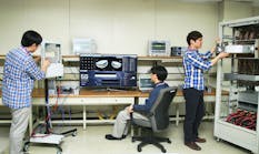 Samsung engineers, in 2013, set up tests for the chipmaker&apos;s early 5G equipment. More recent advances have produced smaller and more efficient parts for 5G wireless networks. (Image courtesy of Samsung).