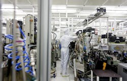 An Infineon Technologies adjusts equipment in a semiconductor cleanroom in Dresden Germany Image courtesy of Infineon An Infineon Technologies adjusts equipment in a semiconductor cleanroom in Dresden Germany Image courtesy of Infineon