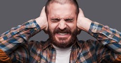 Holding ears Holding ears