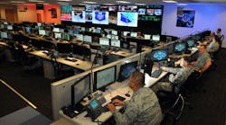 These Air Force cybersecurity specialists are at work in an operations center, ensuring the safety of USAF communications networks.