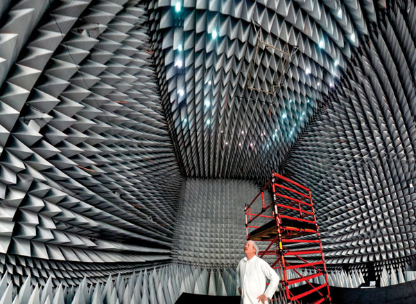 Pictured is Jim Keyser Manager of Lockheed Martins GPS Processing Facility He stands in the anechoic test chamber where the company will perform tests on the GPS III spacecraft to ensure that all of its signals and interfaces work properly