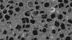 This photograph shows the microstructure of the high-thermal-conductivity aluminum diamond material used for heat sinks and in packages for high-power RF/microwave devices, such as GaN transistors. (Photo courtesy of Nano Materials International Corp.) This photograph shows the microstructure of the high-thermal-conductivity aluminum diamond material used for heat sinks and in packages for high-power RF/microwave devices, such as GaN transistors. (Photo courtesy of Nano Materials International Corp.)