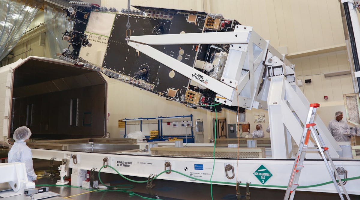 Lockheed Martin technicians are shown loading the Hellas-Sat-4/SaudiGeoSat-1 communications satellite into its shipping container for transport to an environmental test site in Sunnyvale, Calif.