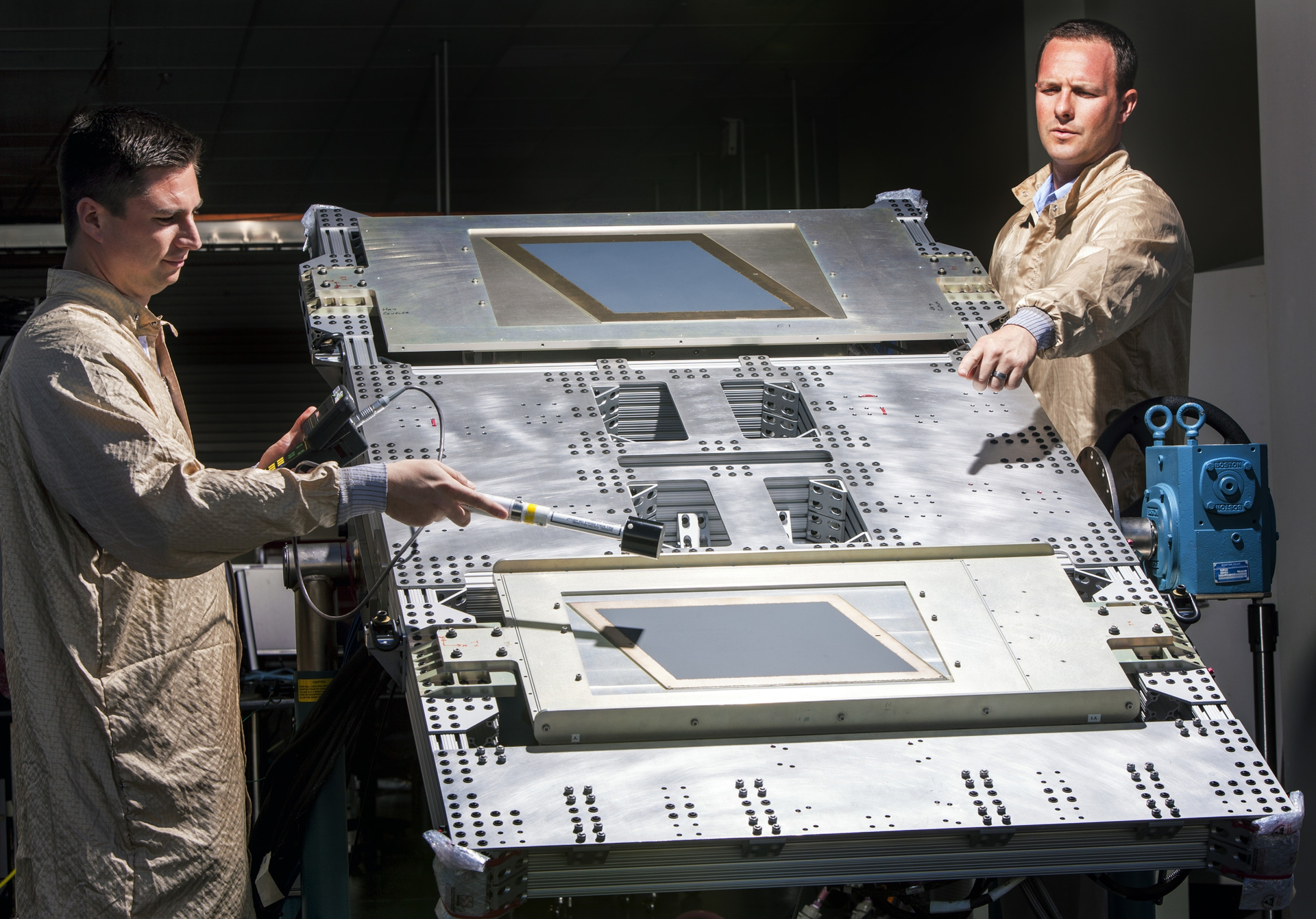 Two engineers check the RF power levels of the AESA antenna as they ready it for the satellite demonstration