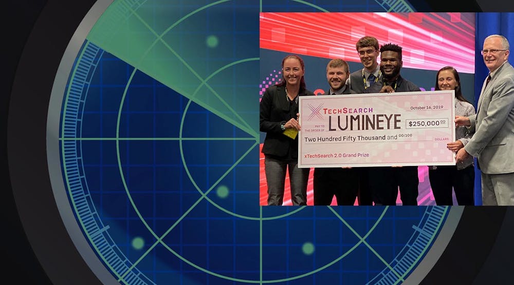 Assistant Secretary of the Army (Acquisition, Logistics and Technology) Bruce Jette (right) presents the xTechSearch 2.0 grand prize to Lumineye for its wall-penetrating radar technology.