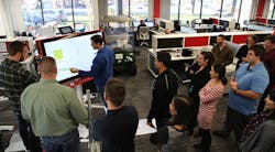 Engineers at IPS collaborate around the Google Jamboard that they helped develop. Engineers at IPS collaborate around the Google Jamboard that they helped develop.