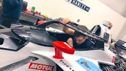 A DragonSpeed team member works in the Aeroscreen. A DragonSpeed team member works in the Aeroscreen.