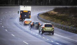 2. This dash-cam image captured four vehicles performing spontaneous platooning behind a large truck, which lowers wind resistance even further than an open formation. According to the driver who observed it, the car closest to the truck acted as sort of a 'ring leader' by holding spaces open for the other vehicles to form the platoon before easing into position behind the truck. (Credit: Next Big Future) 2. This dash-cam image captured four vehicles performing spontaneous platooning behind a large truck, which lowers wind resistance even further than an open formation. According to the driver who observed it, the car closest to the truck acted as sort of a 'ring leader' by holding spaces open for the other vehicles to form the platoon before easing into position behind the truck. (Credit: Next Big Future)
