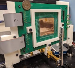 1. The complete, assembled 98- × 98-element reflectarray shows its overall small size and fixturing. 1. The complete, assembled 98- × 98-element reflectarray shows its overall small size and fixturing.