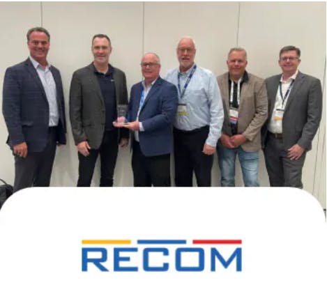 Representatives from RECOM Power present the Mouser team with the 2025 Americas High Service Distributor of the Year Award